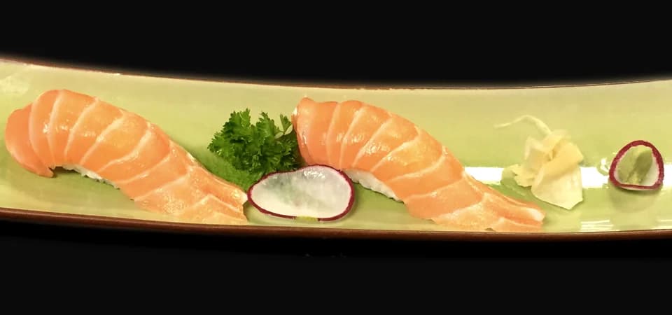 Salmon nigiri photographed by Bon Sushi in Oak Bay