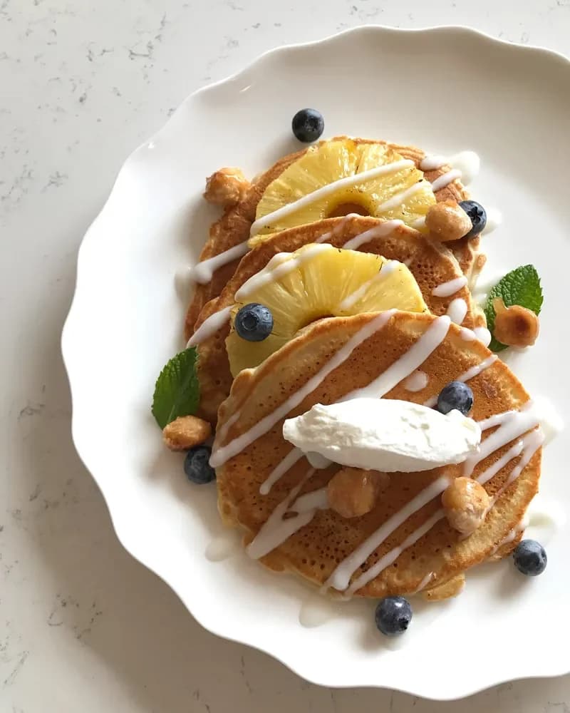 Liv’s pancakes with grilled pineapple, blueberries and coconut syrup