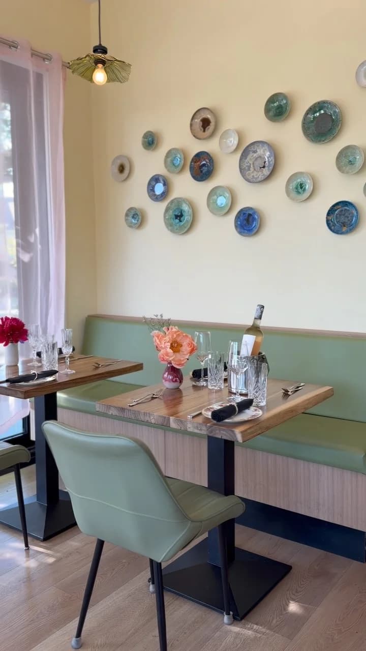 A table beside the green banquette at Liv Café & Bistro