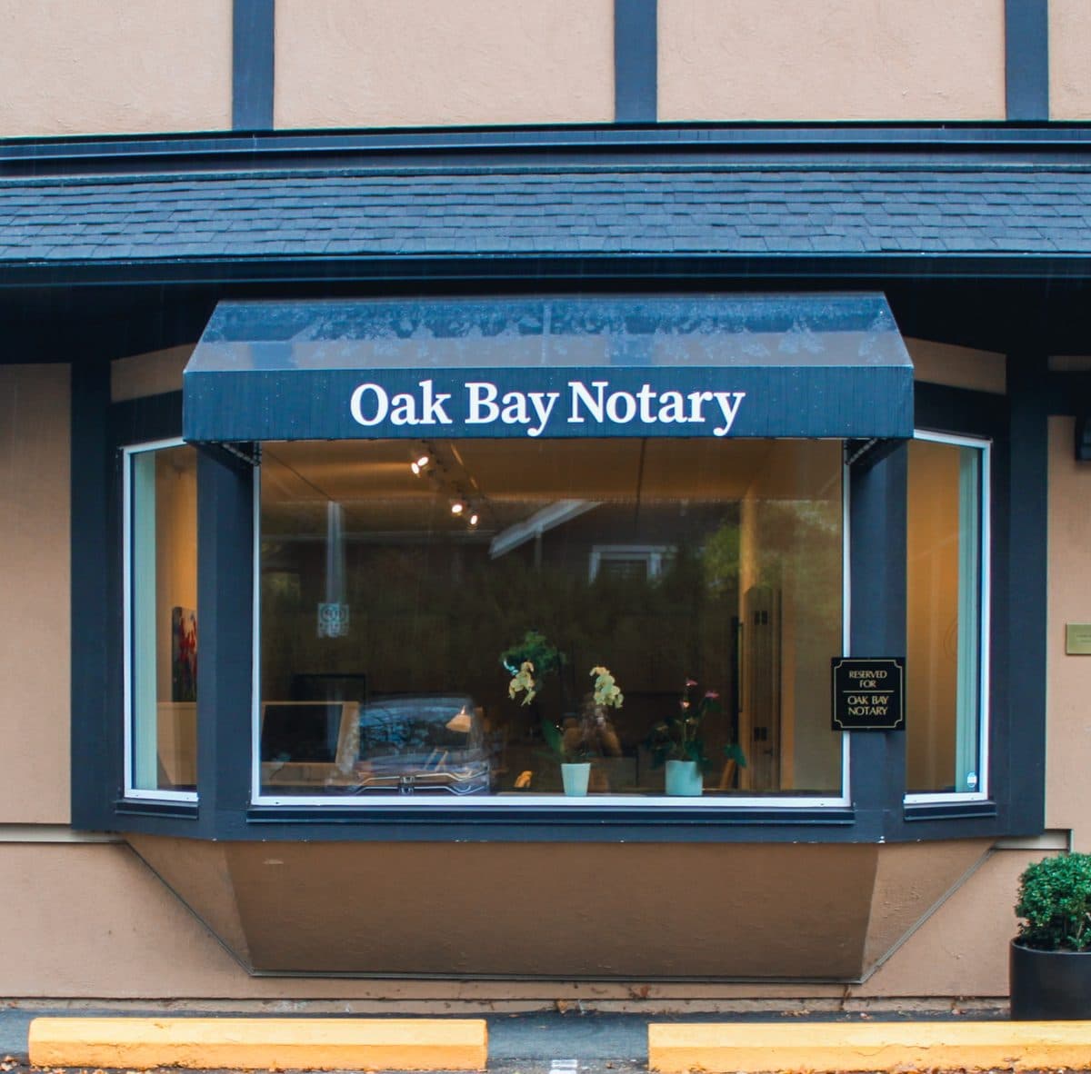 The Oak Bay Notary storefront on Theatre Lane