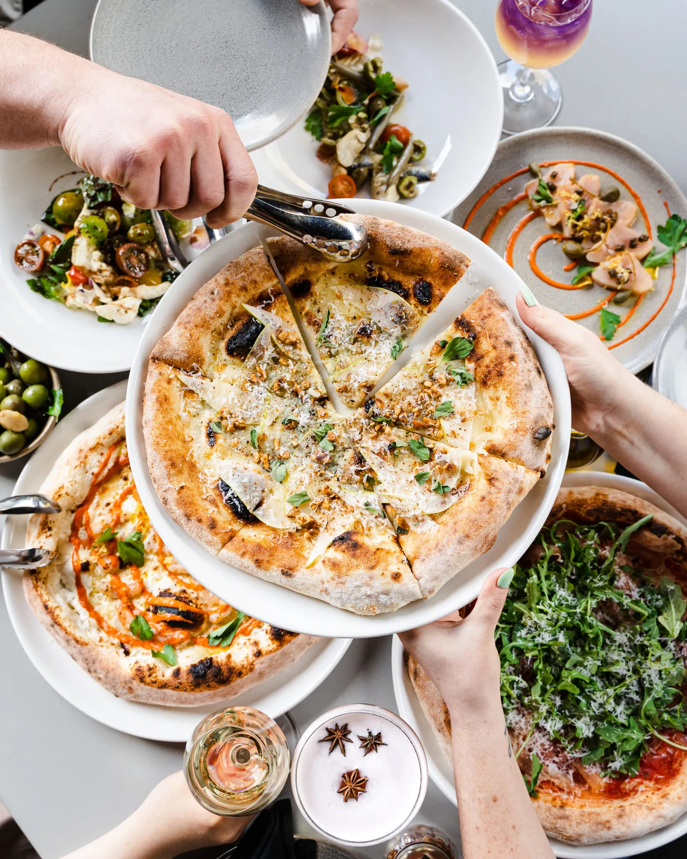 Pizza and shared dishes at FARO at the Oak Bay Beach Hotel.